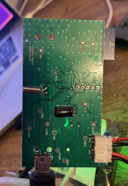Green PCB with micro USB and power cables connected