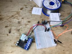 WSM16-W1 module connected to a breadboard with several wires.