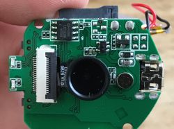 Close-up of PCB with flash chip C74014 and flat ribbon connector