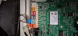 Image of the interior of an electronic device with visible connectors and wires.