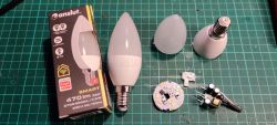 Disassembled smart LED bulb with visible components