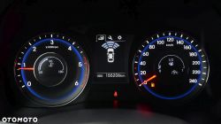 Car dashboard with speedometer, tachometer, and fuel gauge.
