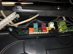 Electrical connection panel of an Ariston boiler with various wire labels.