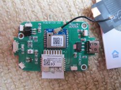 Circuit board with electronic components and communication modules.