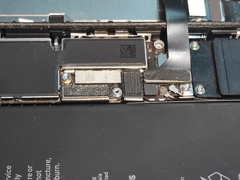 Interior of an Open iPhone Close-up of an open iPhone interior, showing cables and connectors.