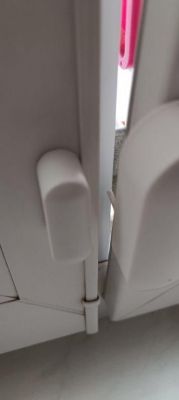 Sensor mounted on the frame of an open window.