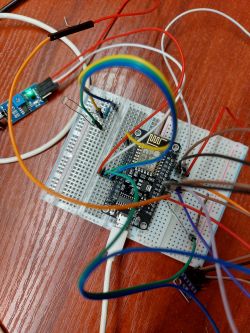 Breadboard with connected wires and an ESP8266 module.
