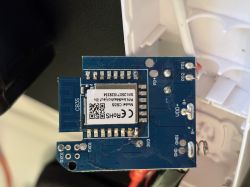 Blue PCB with CB3S module and printed antenna; solder pads and plastic housing visible.