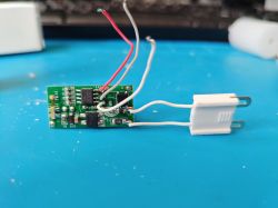 Image of an Electronic Module with Wires Electronic module with wires on a blue background.