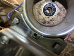 Dirty part of a Krups coffee machine with residues and grime.