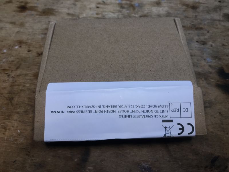Box with ESP32-C3 Module Small brown box with a label and CE mark.