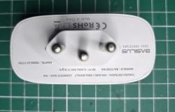 BASILUS Smart Plug - Top View Top view of a BASILUS smart plug with three plug prongs.