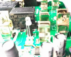 Close-up of a circuit board with YONGWEI Y32F relays.