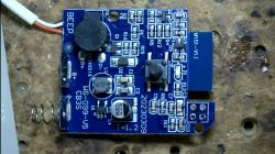 The interior PCB of a Tuya BK7231N water sensor with electronic components.