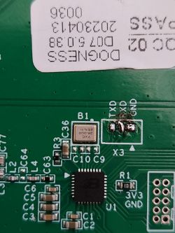 Dogness Device Circuit Board with TXD and RXD Pins Close-up of a Dogness device circuit board showing TXD and RXD pins with various electronic components.