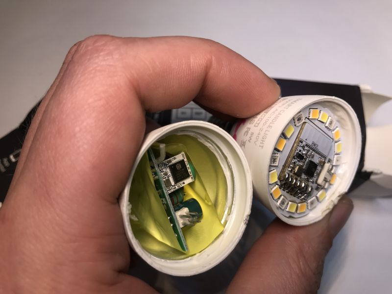 Interior of LED Lighting Module A person holding a disassembled LED lighting module, revealing the interior with electronics.