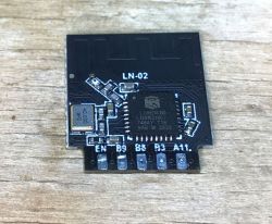 LN-02 electronic module with Lightning Semi LN882H chip on wooden surface