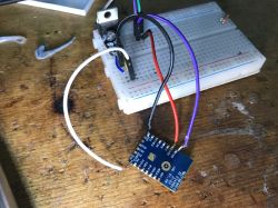 Electronic circuit with wires on a breadboard.