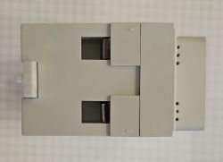 Top view of a gray DIN rail-mounted electrical module