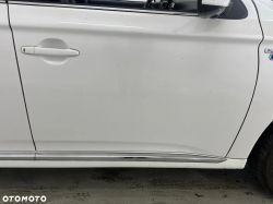 White car door with handle and Plug-in Hybrid badge.