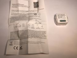 ATLO-SW1-TUYA Wi-Fi Relay Module with User Manual The image shows a small ATLO-SW1-TUYA Wi-Fi relay module and a Polish user manual laid out side by side.