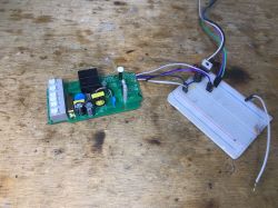 Interior of WS-05H1 with Breadboard Electronics and breadboard on a wooden table