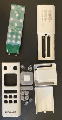 Disassembled LEDVANCE remote control showing internal components and individual parts.