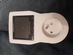ATORCH Smart Energy Socket White smart energy socket with display and three buttons on a dark background.