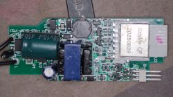 Close-up of a PCB with “cozylife QP 20250829” module and power-supply components