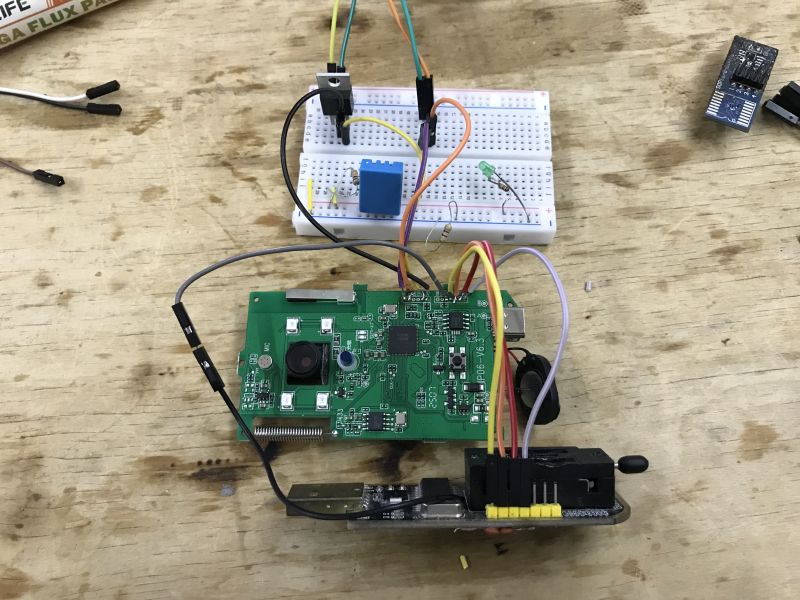 Breadboard with DHT sensor and microcontroller connected to a camera module