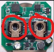Close-up of a circuit board with two sockets marked in red.