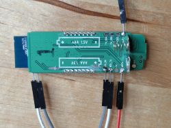 Green PCB with marked AAA 1.5V slots and connected jumper wires.