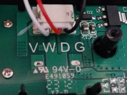 Close-up of a circuit board with integrated circuits and connectors, marked with VWDG.