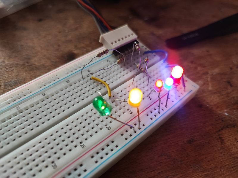 Testing LEDs on a Breadboard Breadboard with connected LEDs in various colors.