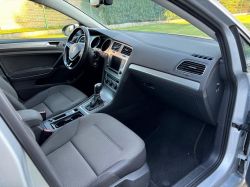 Car interior view showing the dashboard and seats.
