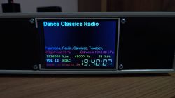 Color display of a device showing internet radio info and environmental data.