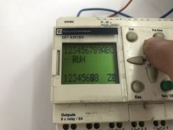 The interior of an old Schneider Electric SR1 A201BD programmable logic controller