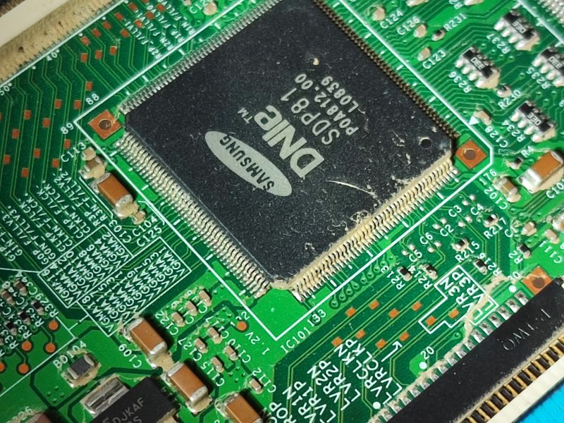 Flood Damage on TV Circuit Board Close-up of a dirty integrated circuit and circuit board in a Samsung TV.