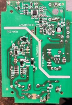 View of a circuit board from an older Falke charger with visible electronic components, including burnt diodes.
