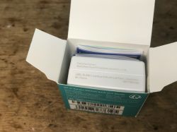 Unboxing Sonoff Mini R2 Open box with a Sonoff Mini R2 module and manual inside.