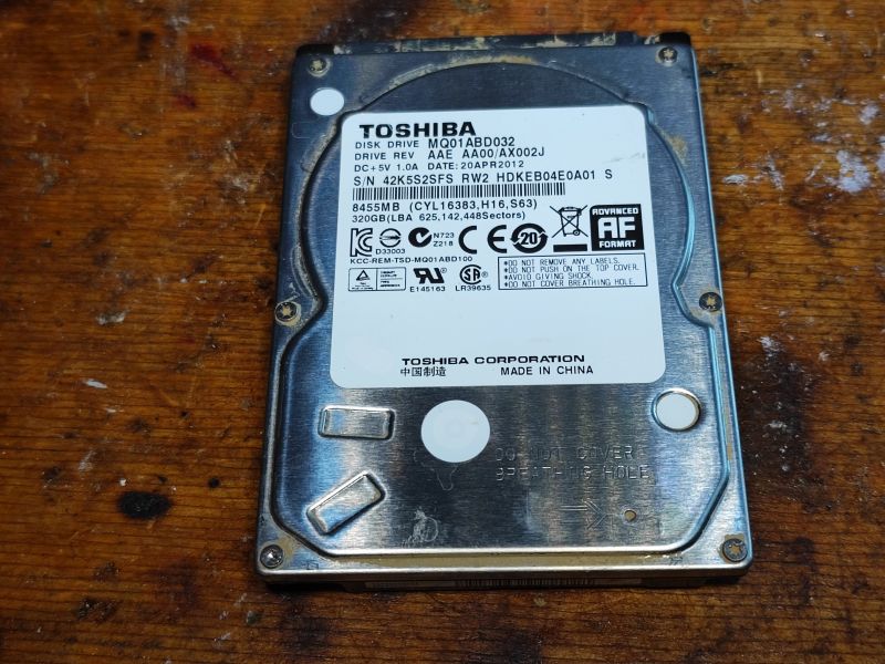 Toshiba MQ01ABD032 HDD from 2012 Toshiba MQ01ABD032 HDD with visible moisture marks