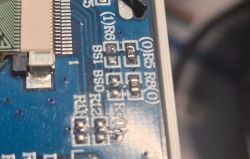 Close-up of a PCB with markings BS1, BS0, R8, R6, and others.