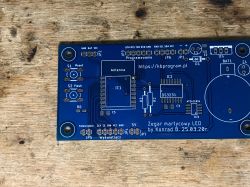 PCB for LED matrix clock with labeled components on a blue background.