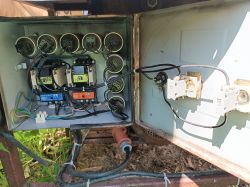 Image of the interior of a control cabinet with wiring and electrical components.