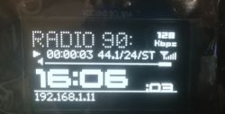 OLED display of an internet radio showing station and time information.