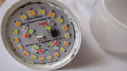 Close-up of the inside of an LED bulb showing LEDs and electronic components.