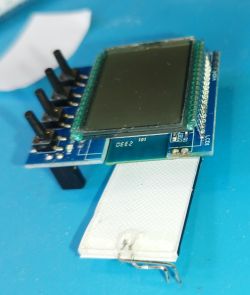 Backlight panel installed behind an LCD display with buttons.