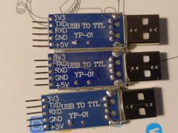 Three USB to TTL converters labeled YP-01 on a white background.
