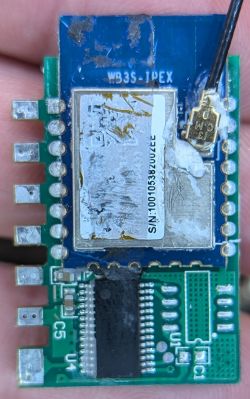 WB3S-IPEX Wi-Fi Module on Green Circuit Board Close-up of the WB3S-IPEX Wi-Fi module on a green circuit board with attached antenna.