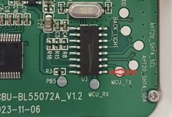 Close-up of a circuit board with an arrow pointing to the MCU_RX label.